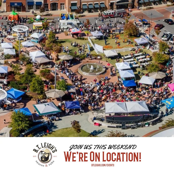 Aerial view of a vibrant outdoor market with tents, crowds, and booths at a B.T. Leigh's Sauces and Rubs event.