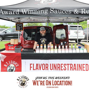 B.T. Leigh's Sauces and Rubs market booth with artisanal BBQ sauces display and branded tent.