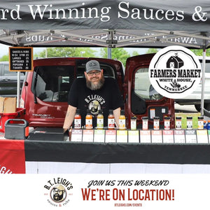 B.T. Leigh's Sauces and Rubs booth at White House Tennessee Farmers Market, featuring artisanal barbecue sauces.