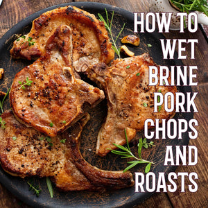 Juicy pork chops on a rustic plate with herbs, highlighting how to wet brine pork for BBQ.