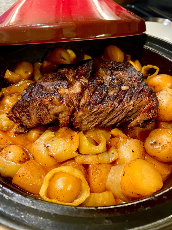 Savory harissa chuck roast with potatoes and onions in a red Dutch oven, B.T. Leigh's style
