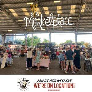 Crowd shopping at SOKY Marketplace, featuring B.T. Leigh's Sauces and Rubs booth.